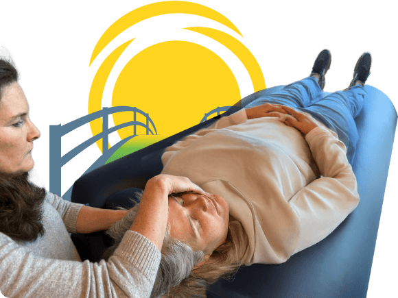 A wellness treatment session featuring a massage therapist working on a client.